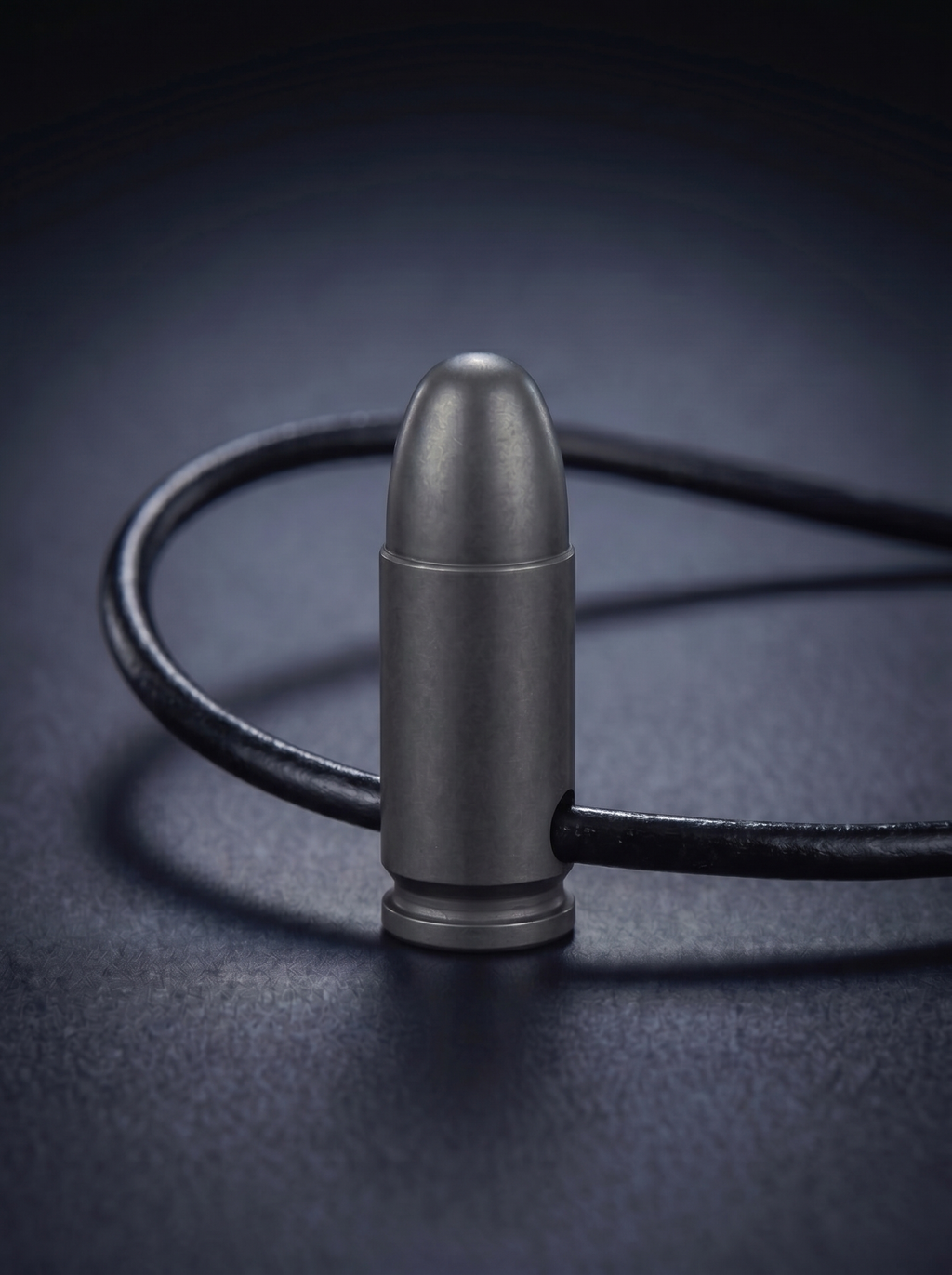 Black titanium pistol cartridge pendant on black leather cord