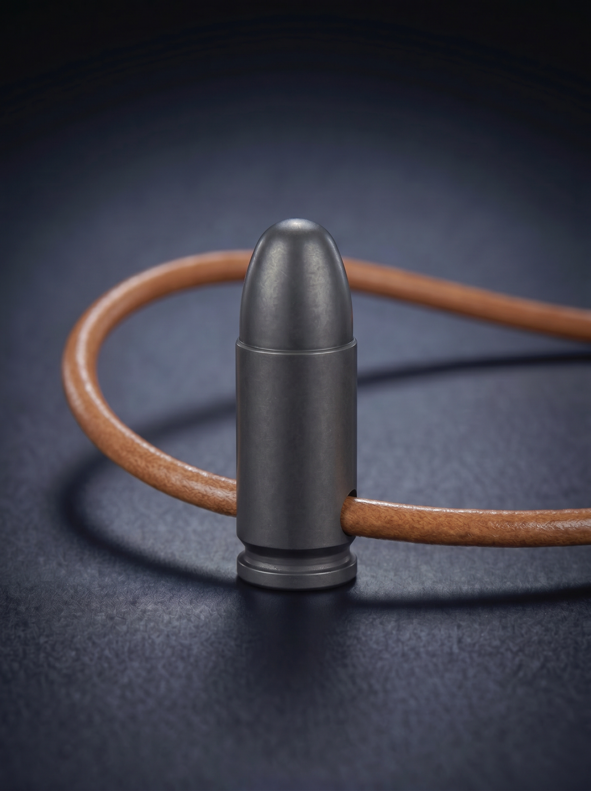 Black titanium pistol cartridge pendant on original leather cord