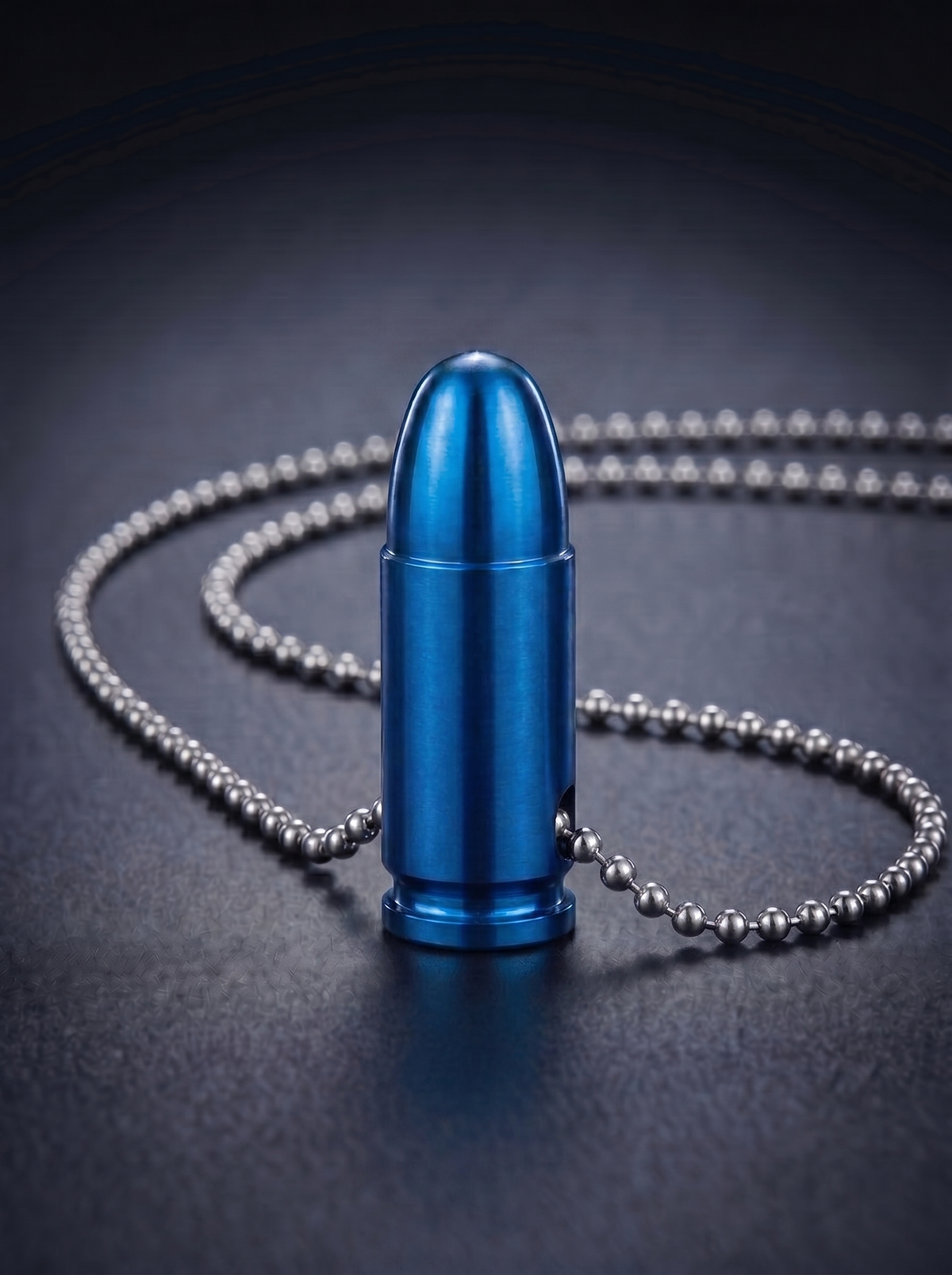 Blue titanium pistol cartridge pendant on ball chain