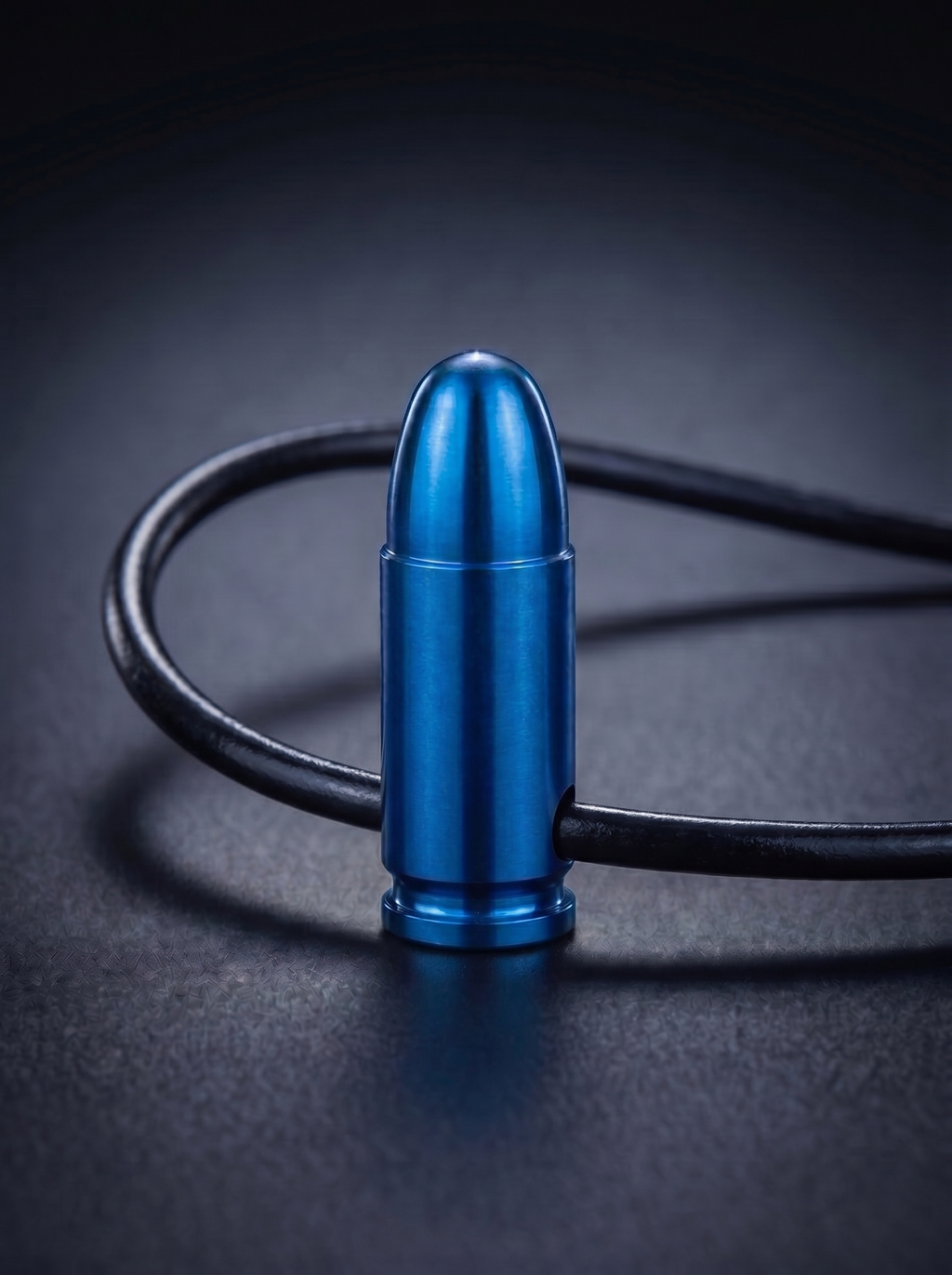 Blue titanium pistol cartridge pendant on black leather cord