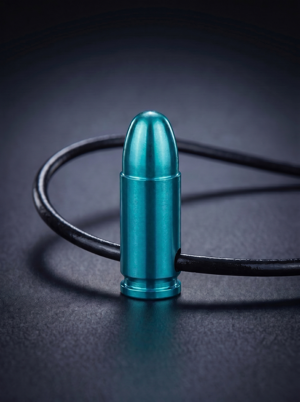 Green titanium pistol cartridge pendant on black leather cord