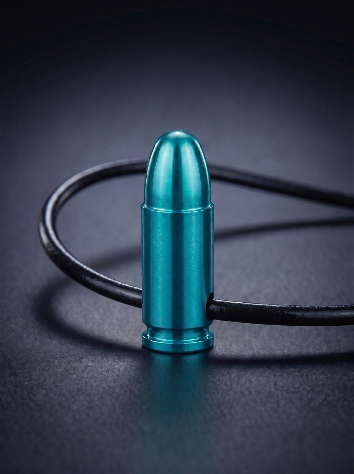 Green titanium pistol cartridge pendant on black leather cord