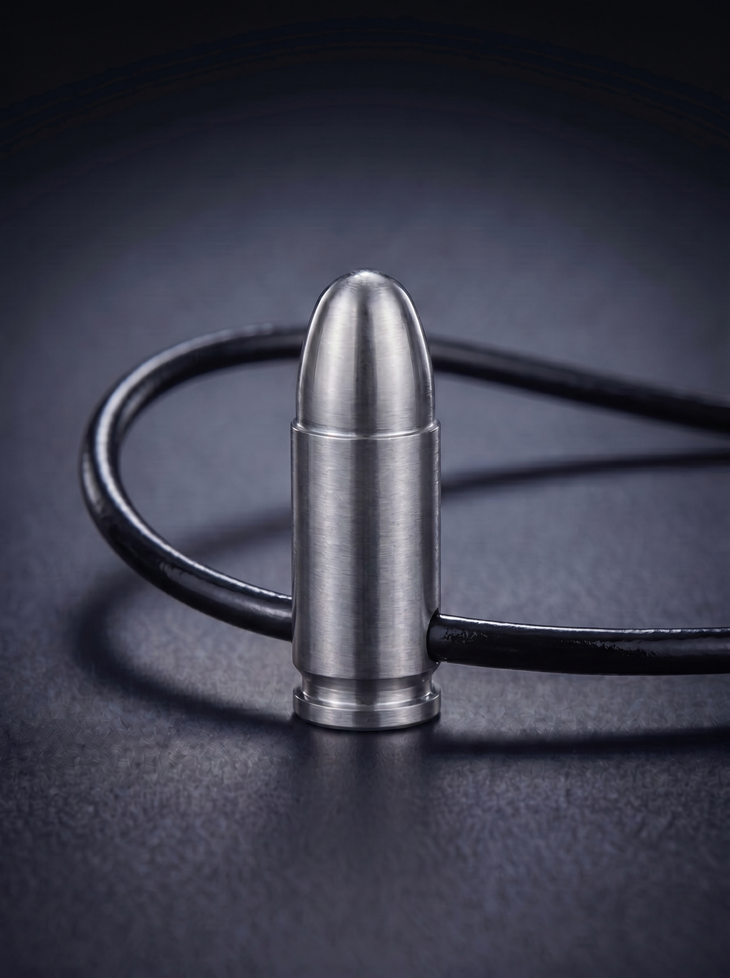 Natural titanium pistol cartridge pendant on black leather cord