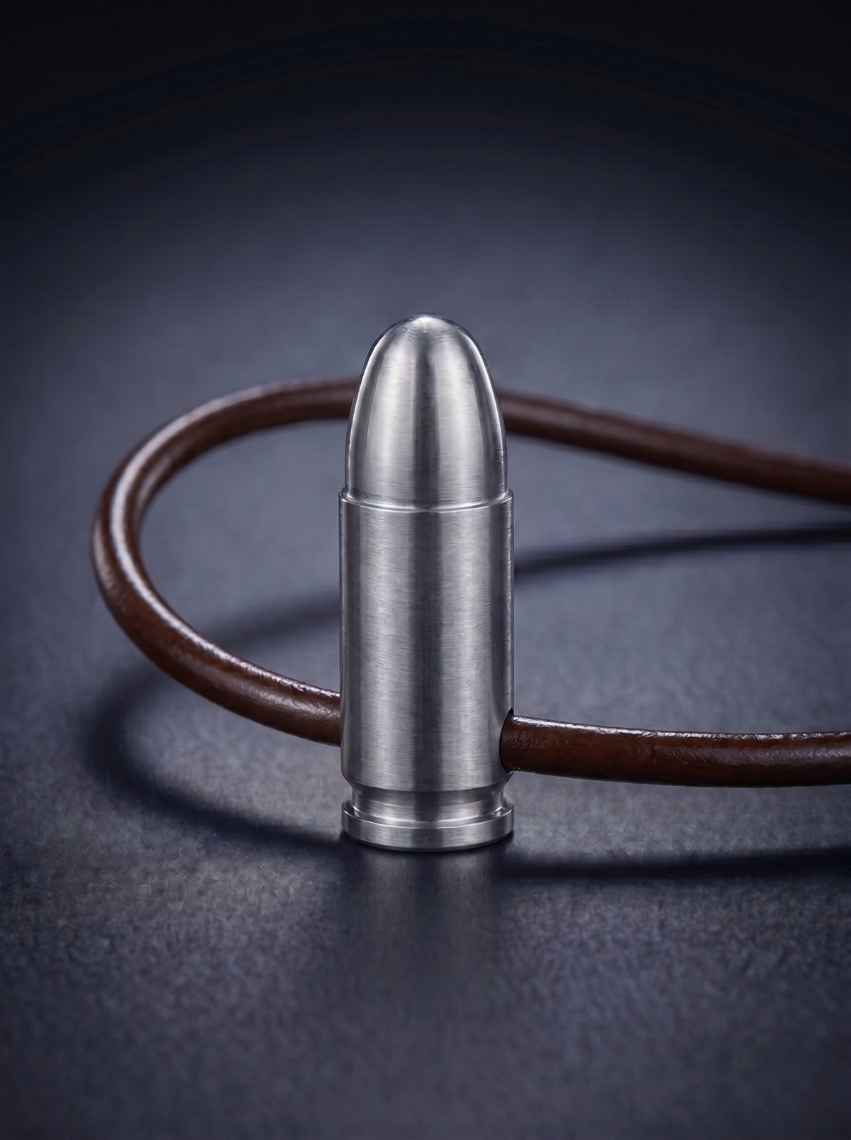 Natural titanium pistol cartridge pendant on brown leather cord