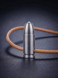 Natural titanium pistol cartridge pendant on original leather cord