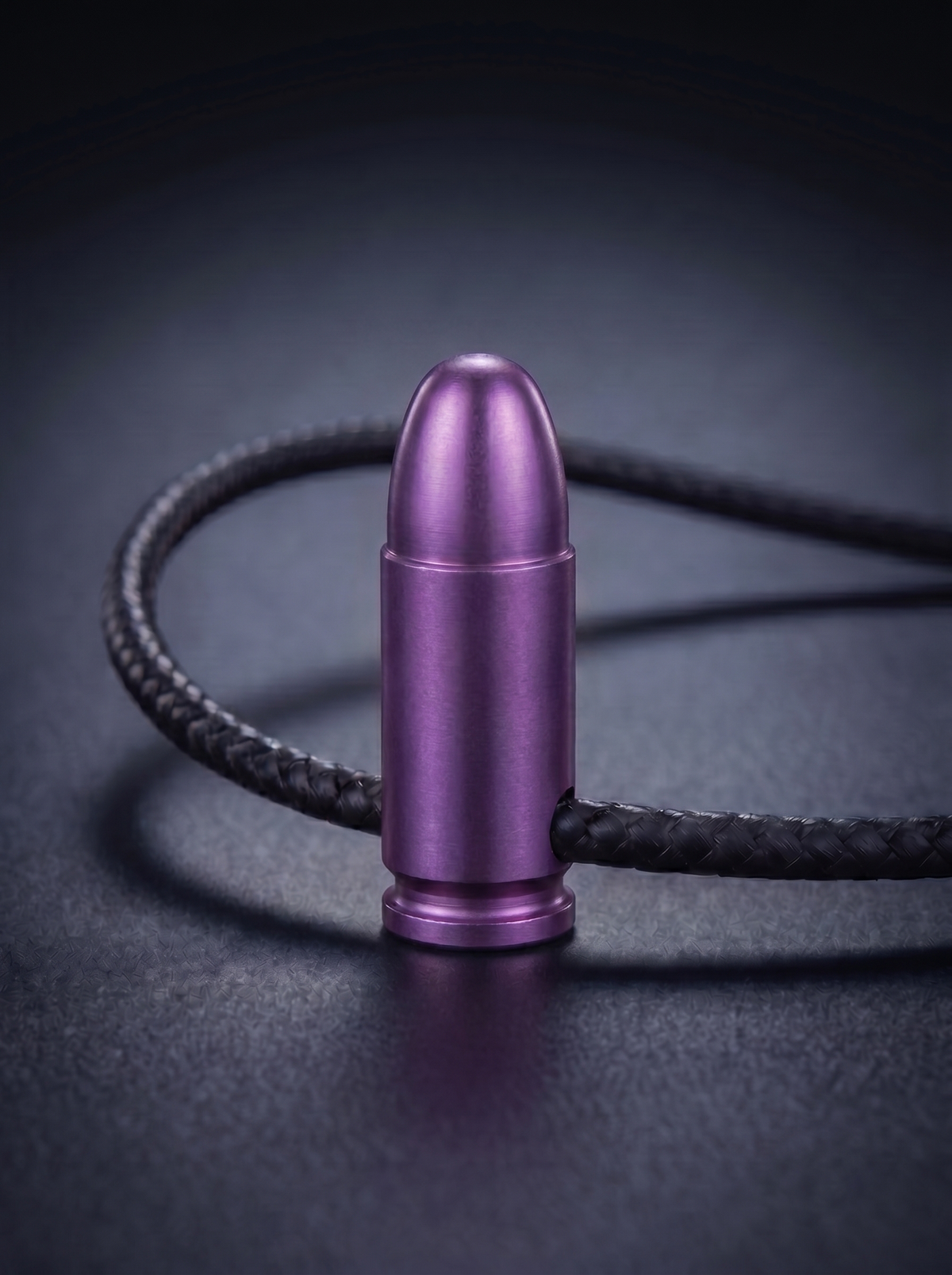 Magenta anodized titanium pistol cartridge pendant