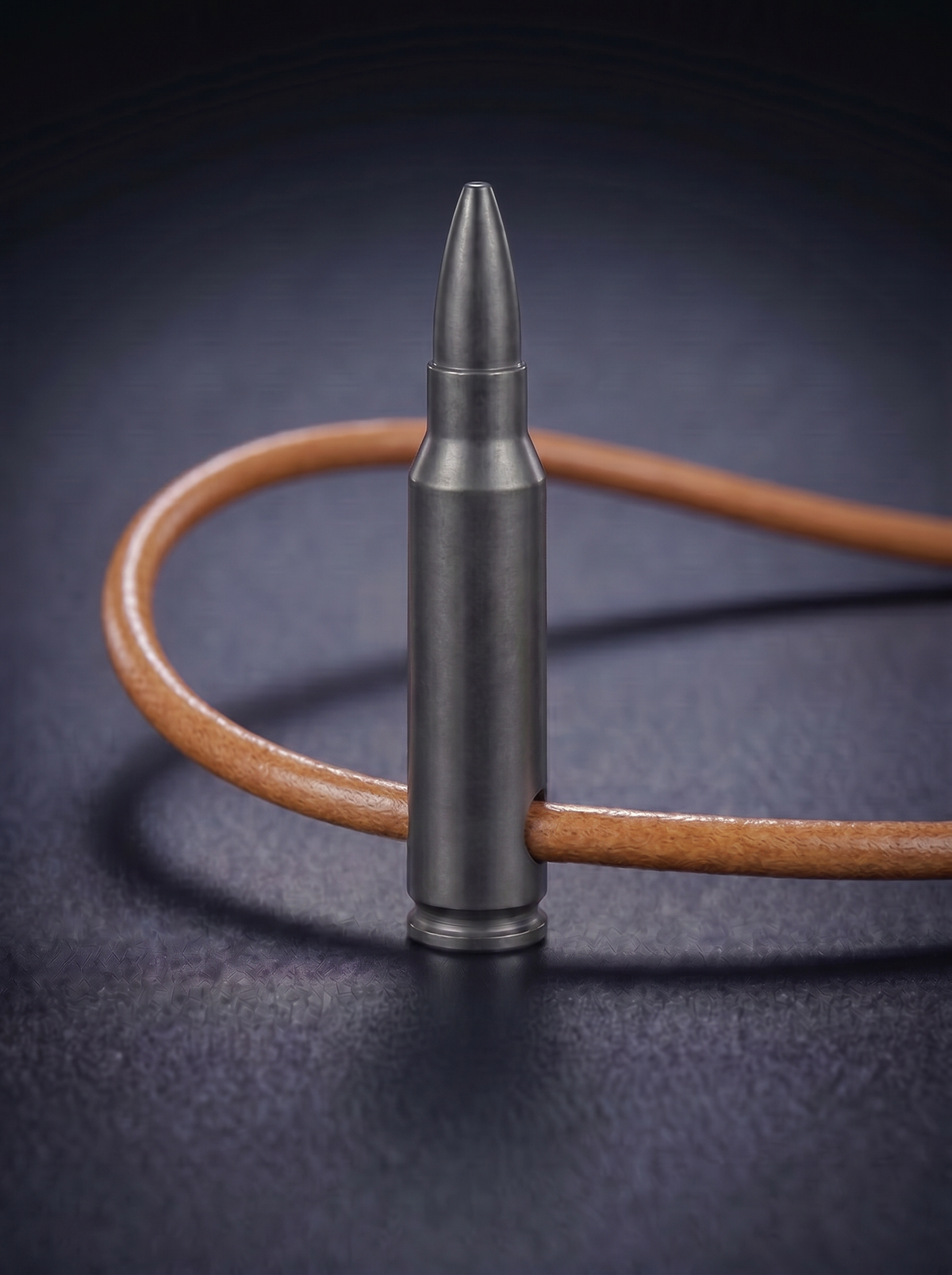Black titanium rifle cartridge pendant on original leather cord