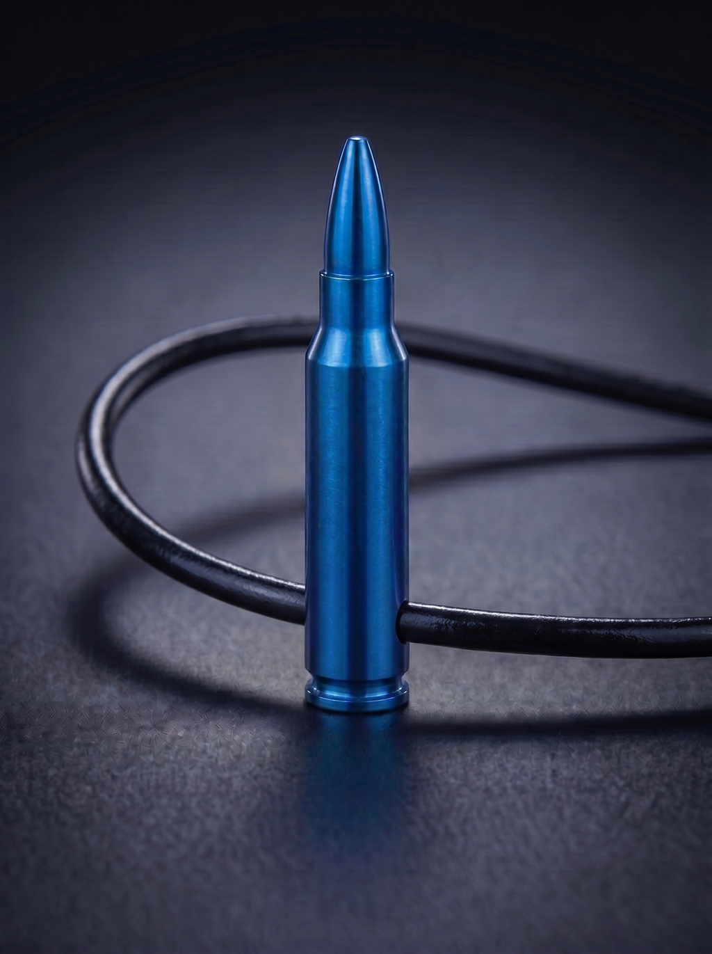 Blue titanium rifle cartridge pendant on black leather cord