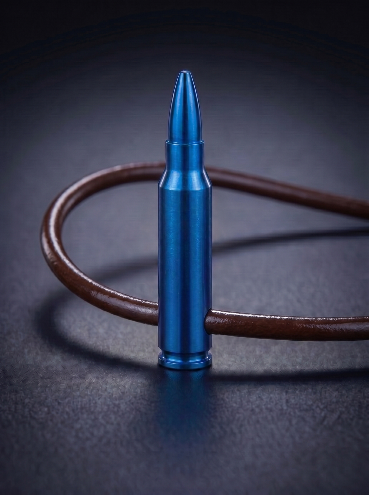 Blue titanium rifle cartridge pendant on brown leather cord