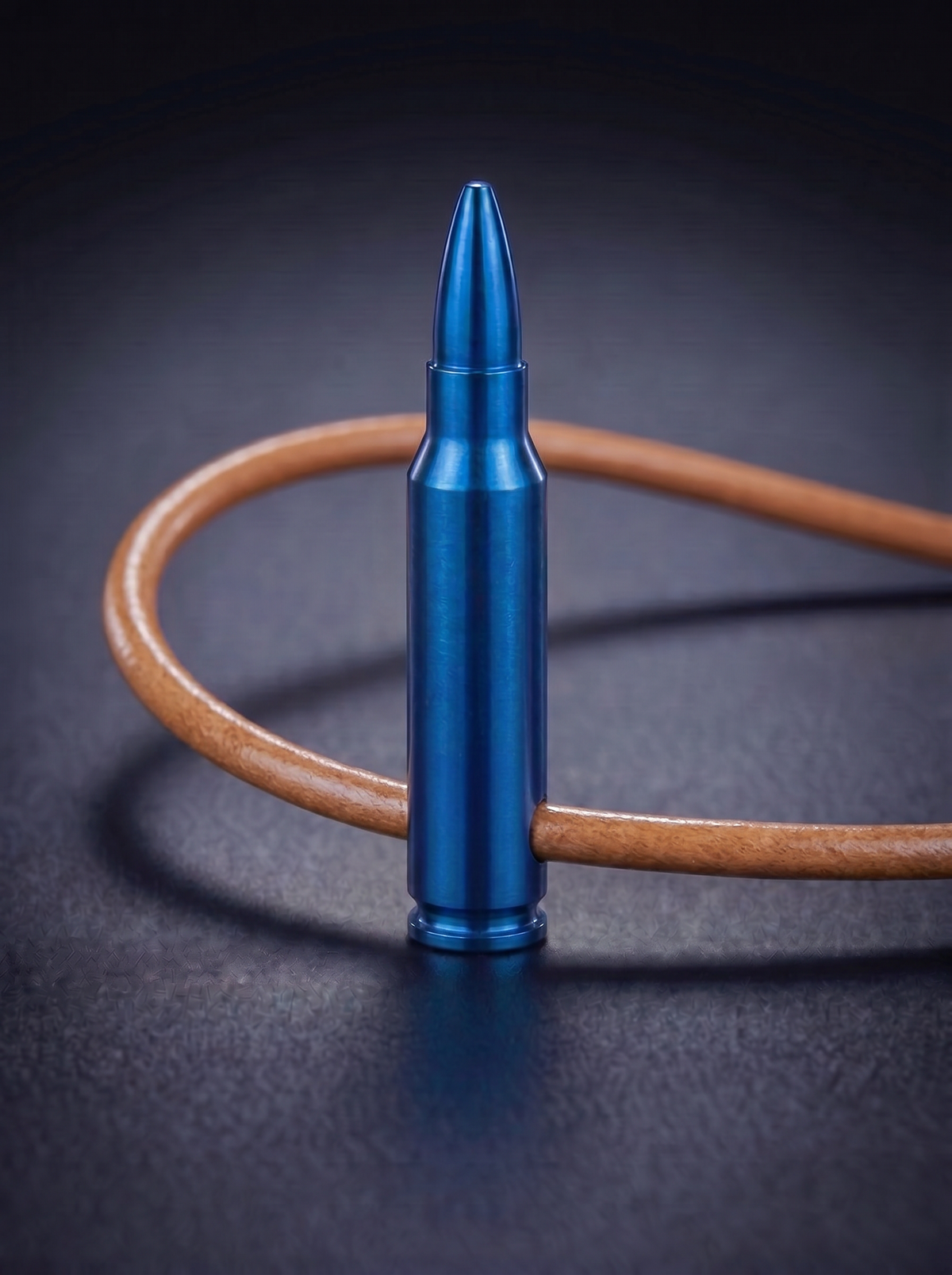 Blue titanium rifle cartridge pendant on original leather cord