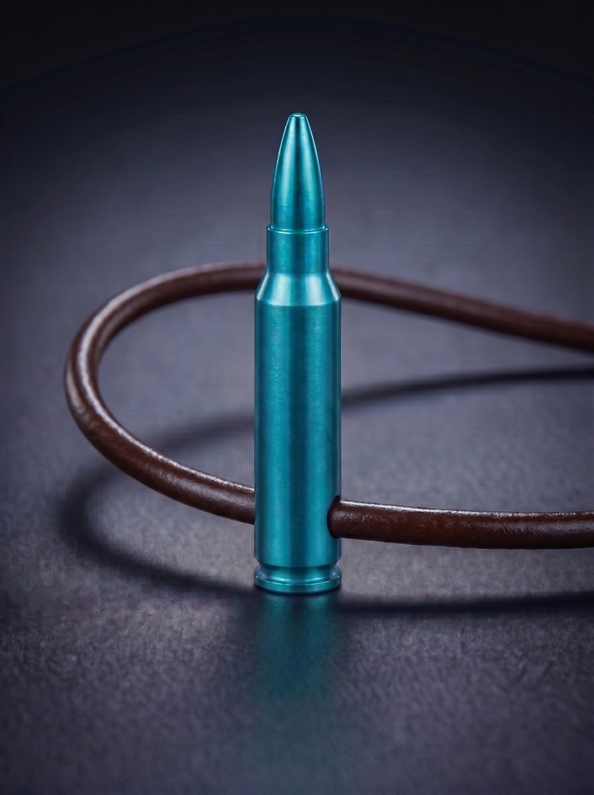 Green titanium rifle cartridge pendant on brown leather cord