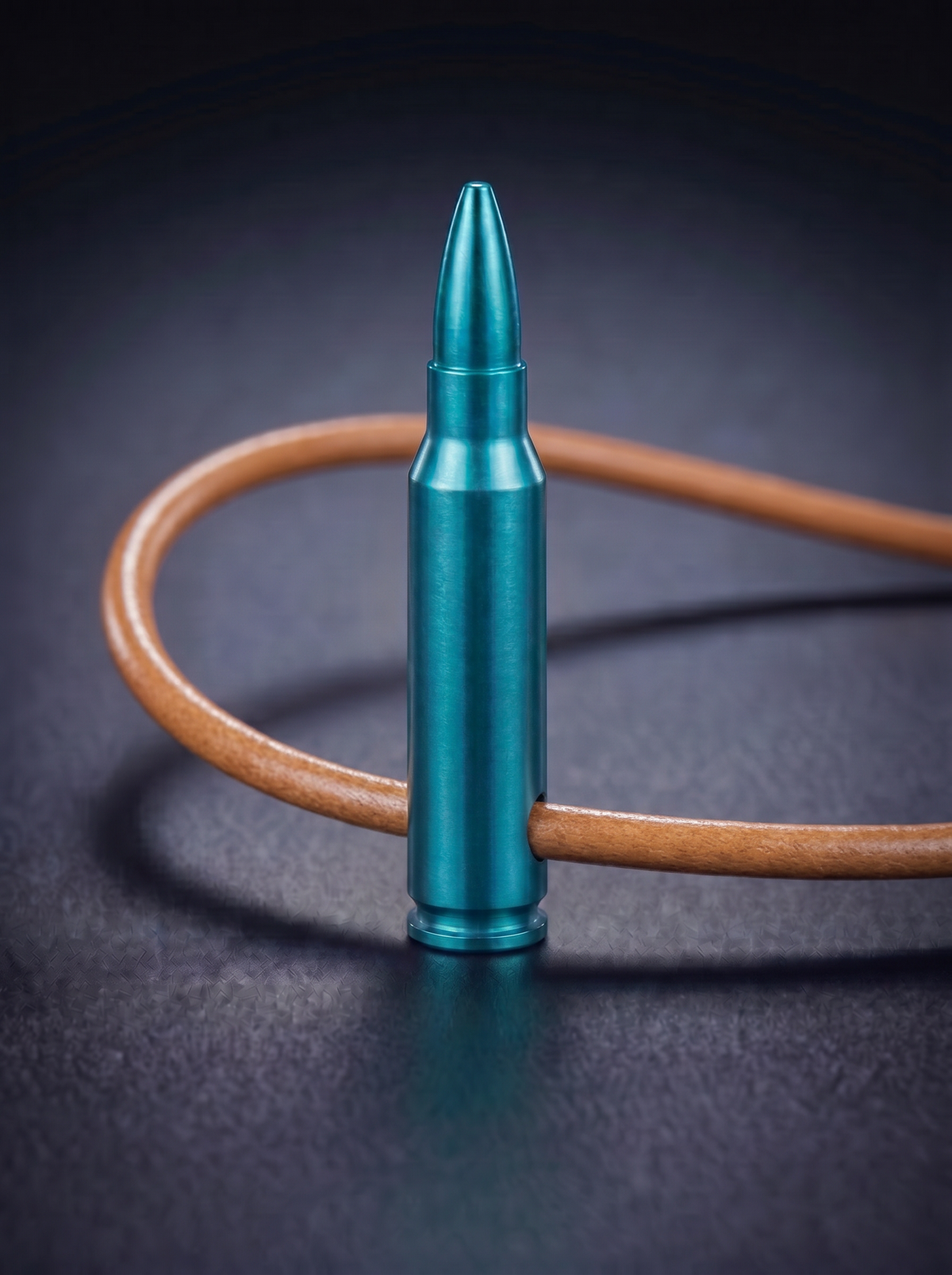 Green titanium rifle cartridge pendant on original leather cord