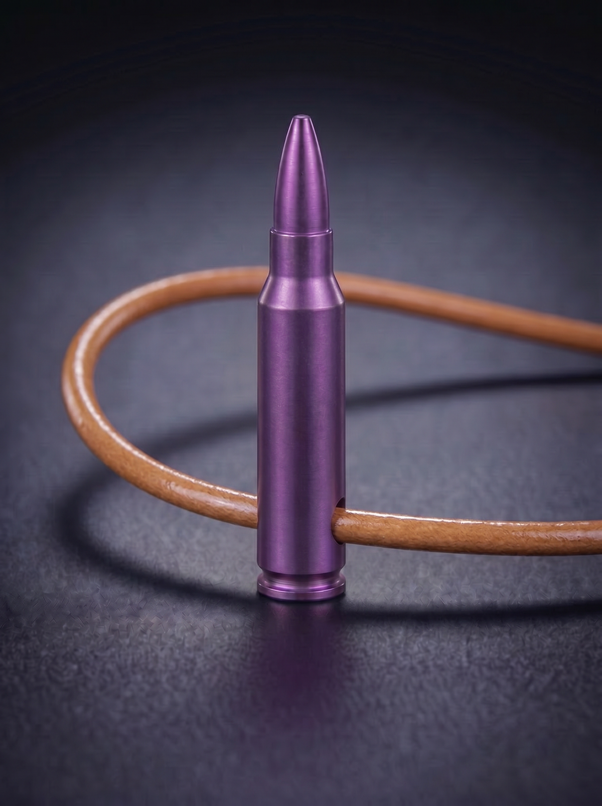 Magenta titanium rifle cartridge pendant on original leather cord