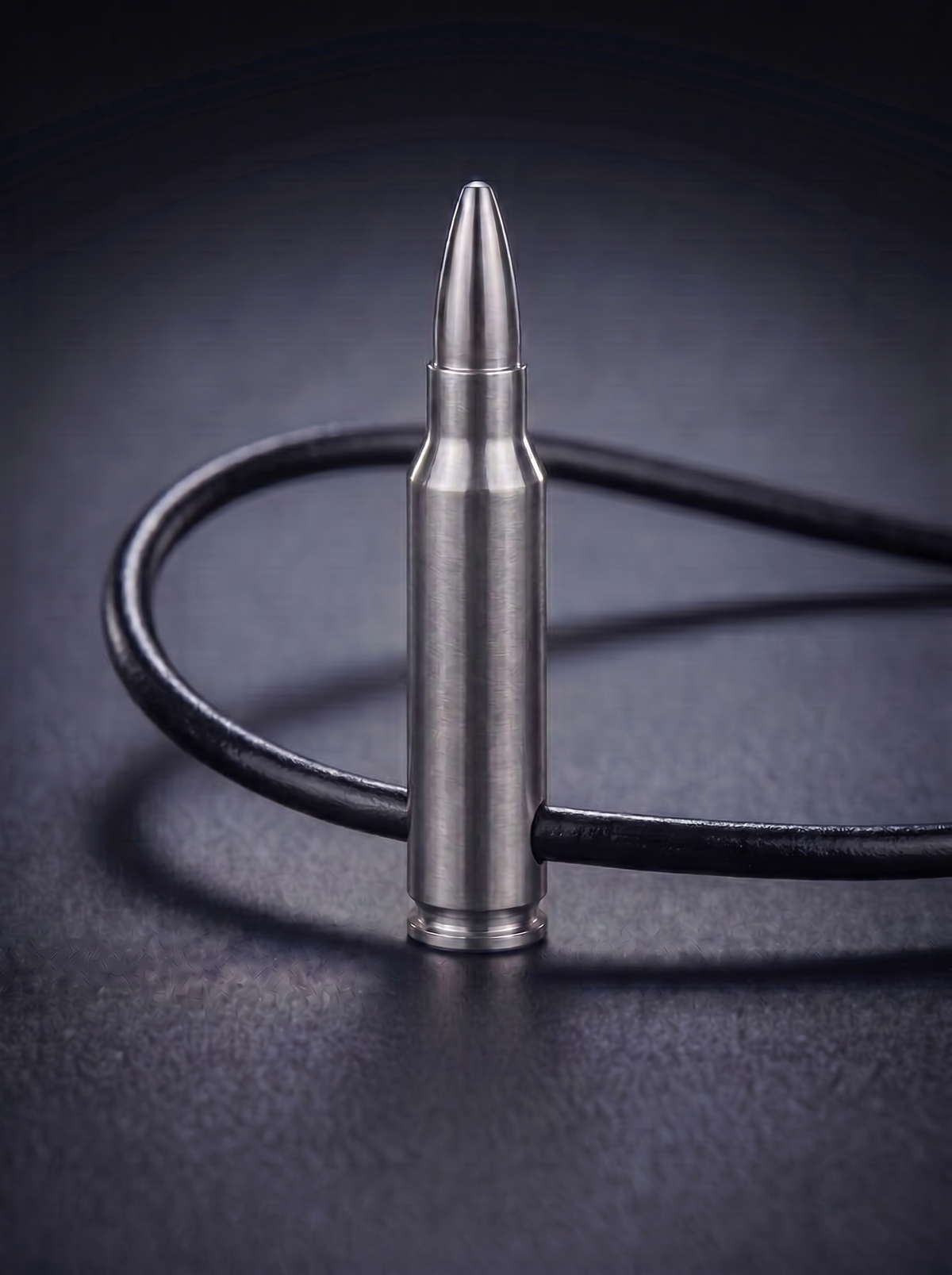 Natural titanium rifle cartridge pendant on black leather cord