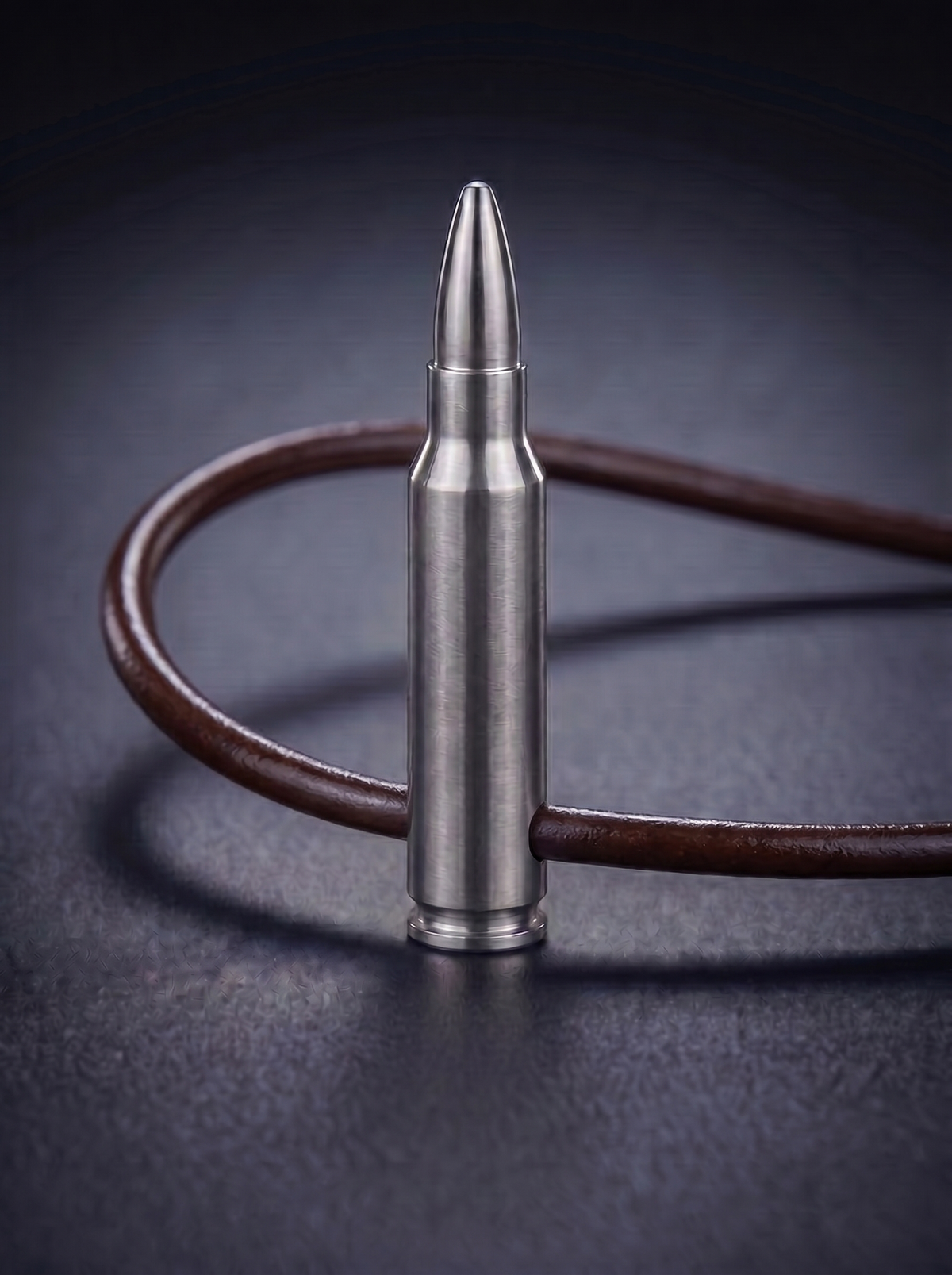 Natural titanium rifle cartridge pendant on brown leather cord