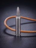 Natural titanium rifle cartridge pendant on original leather cord