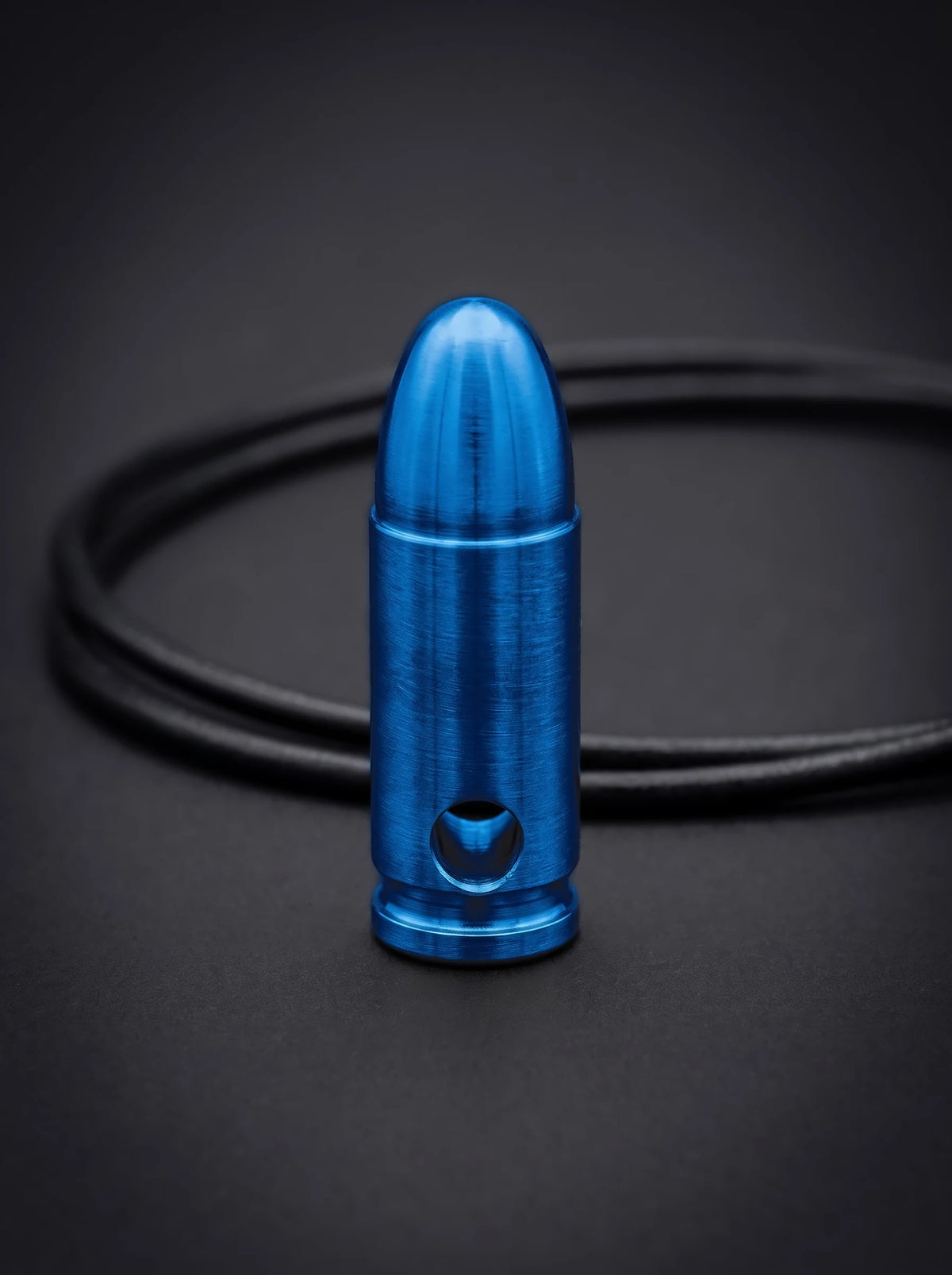 Blue titanium pistol cartridge pendant on black leather cord