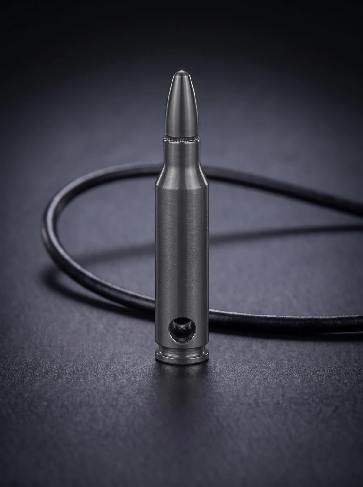 Black titanium rifle cartridge pendant on black leather cord