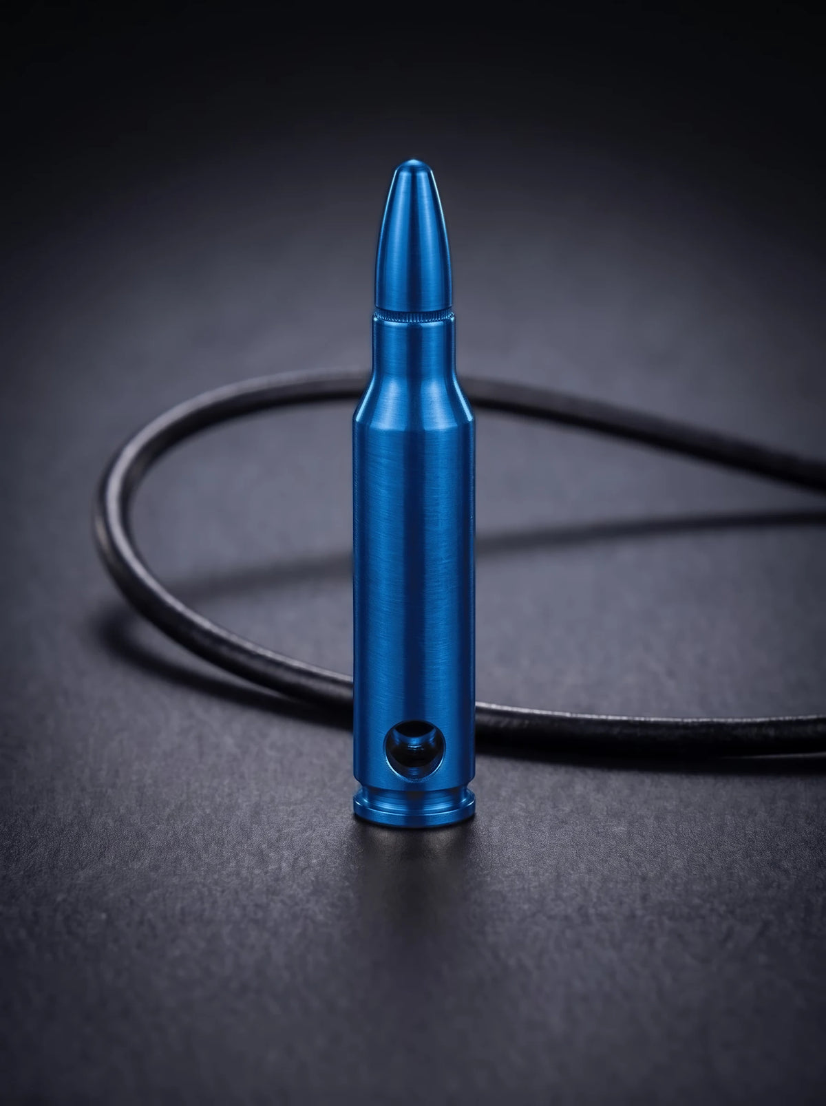 Blue titanium rifle cartridge pendant on black leather cord