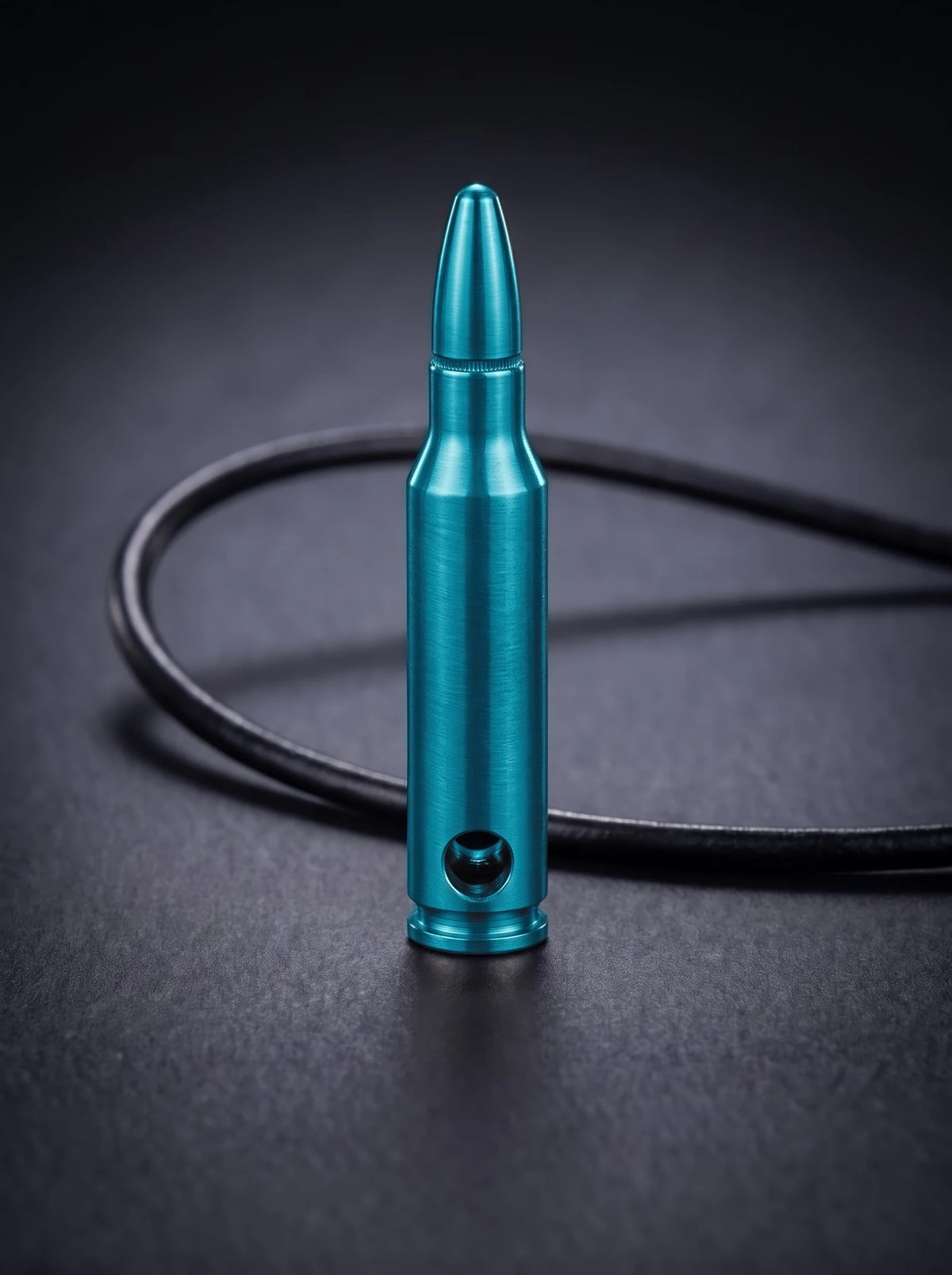 Green titanium rifle cartridge pendant on black leather cord