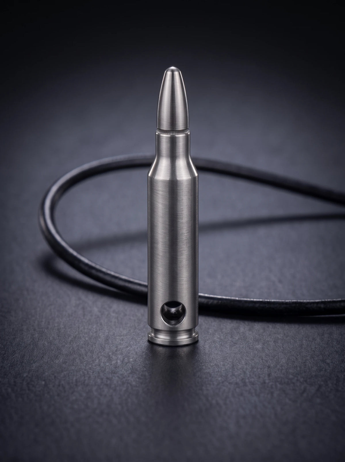 Natural titanium rifle cartridge pendant on black leather cord